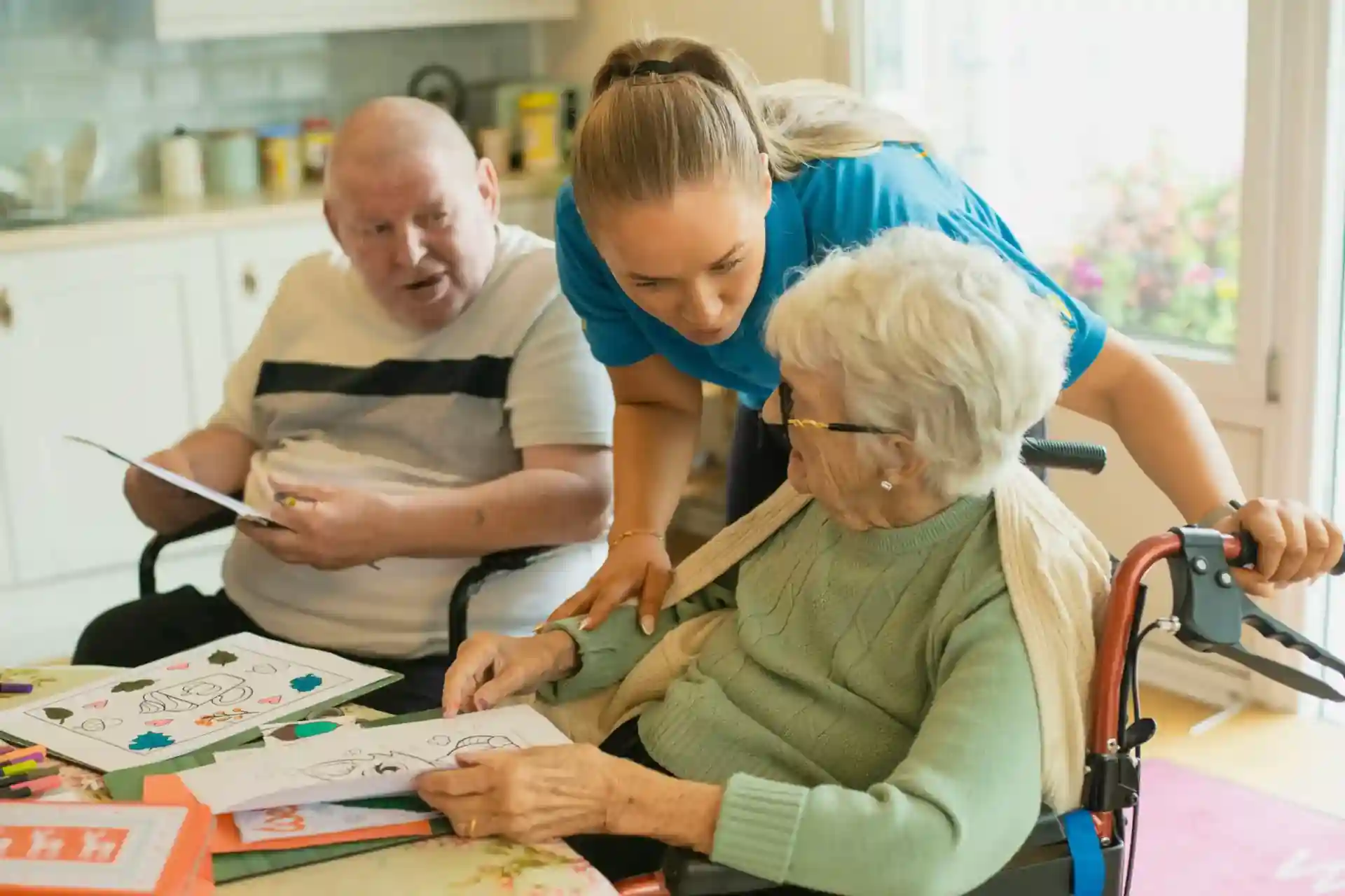 Caregivers providing 1:3 ratio support during resident activities